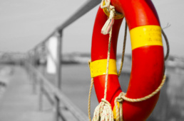 life buoy hanging on dock railing