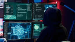 Cybercriminal using AI machine learning to develop zero day exploit undetectable by antivirus software. Hacker using artificial intelligence technology to build script tricking firewalls, camera A